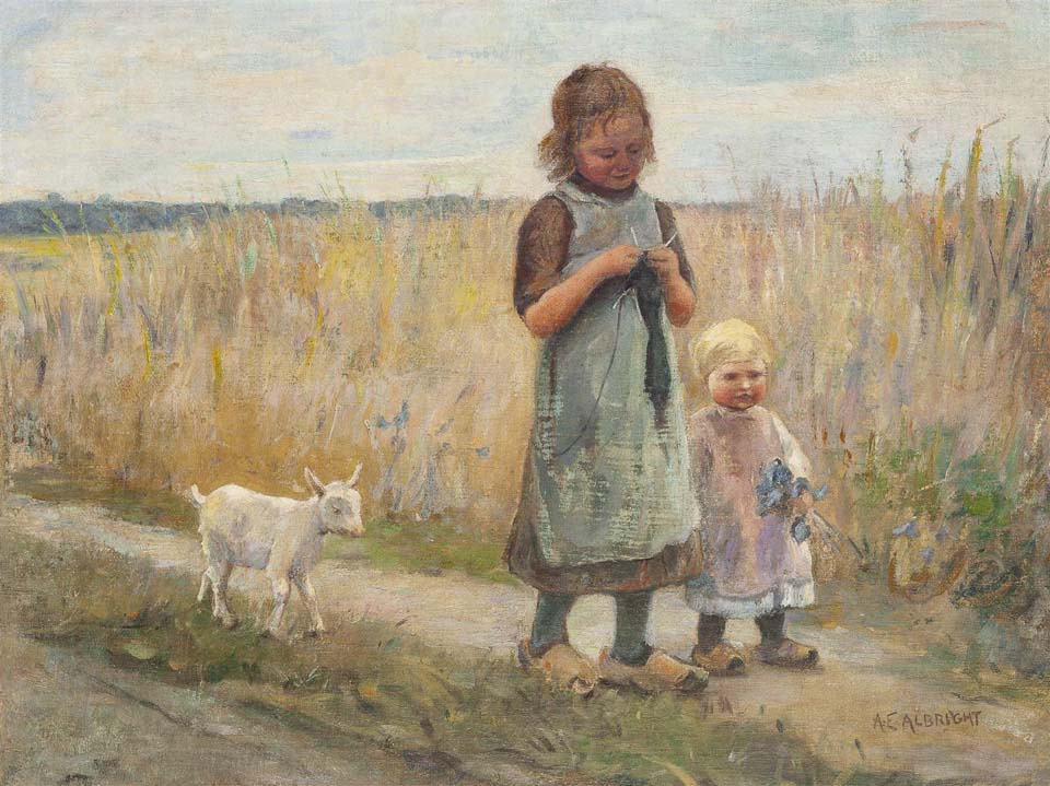 Two children with a goat on a path