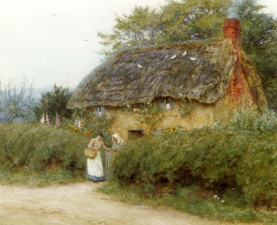 A cottage with sunflowers at Peaslake