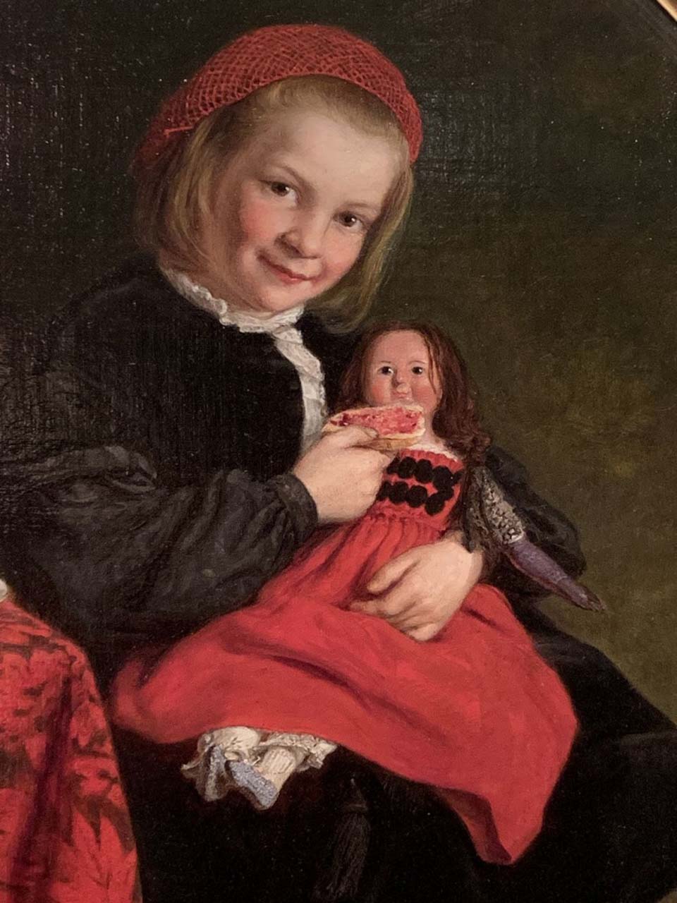 Young girl holding a doll