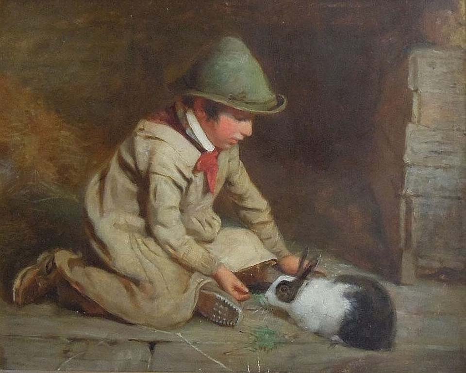 Boy with pet rabbits