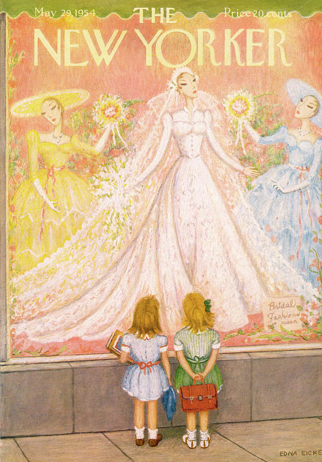 Two little girls admire a wedding dress in a store front window.