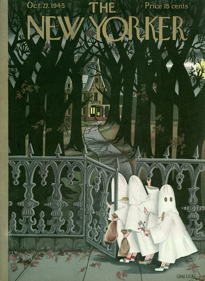 Children dressed as ghosts on Halloween open a gate to trick or treat at a spoky house.