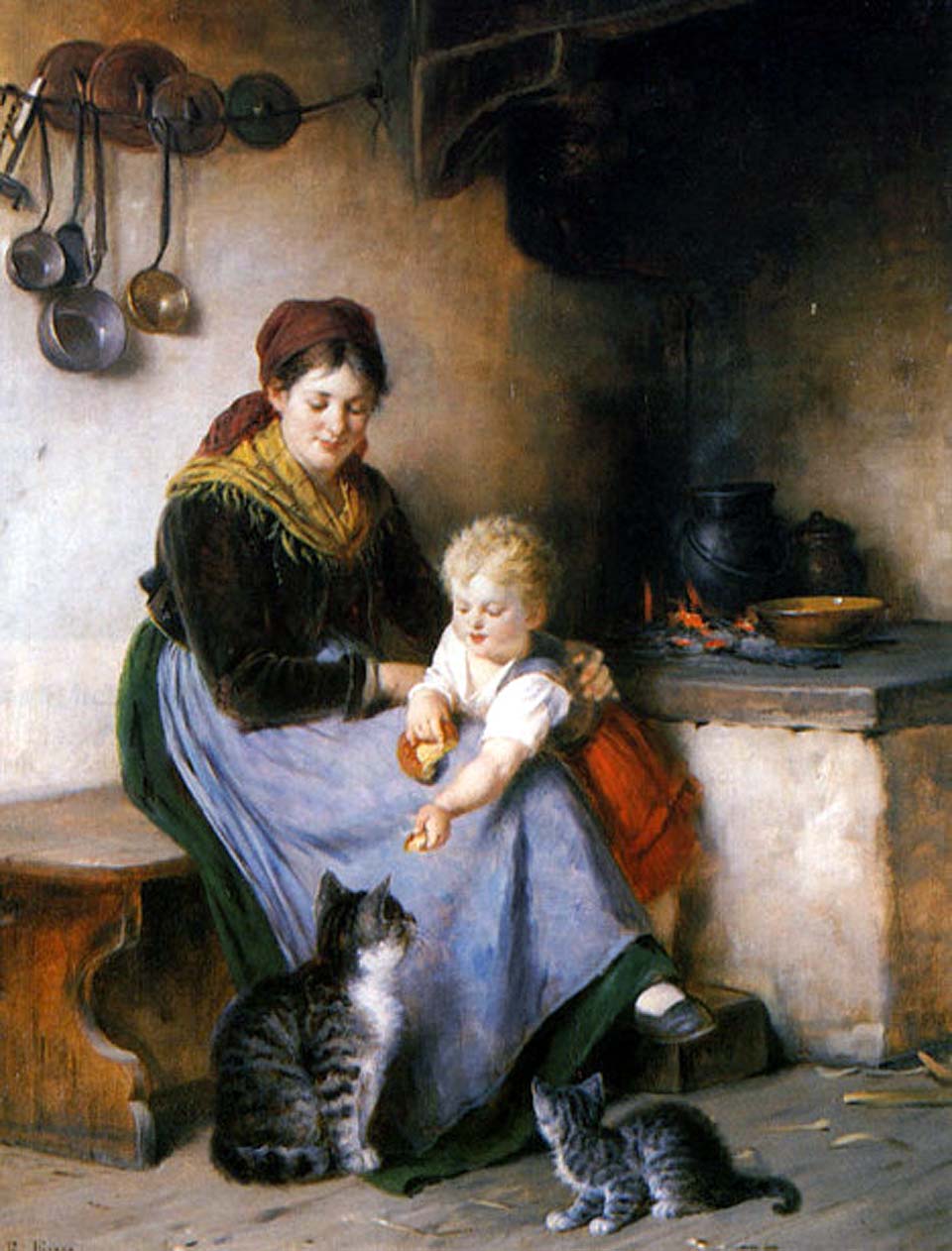 Mother and child feeding cats