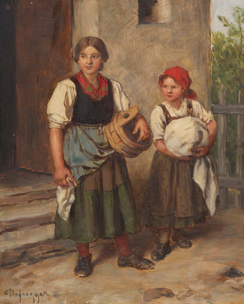 Farmer's wife with a dirndl in front of the washhouse