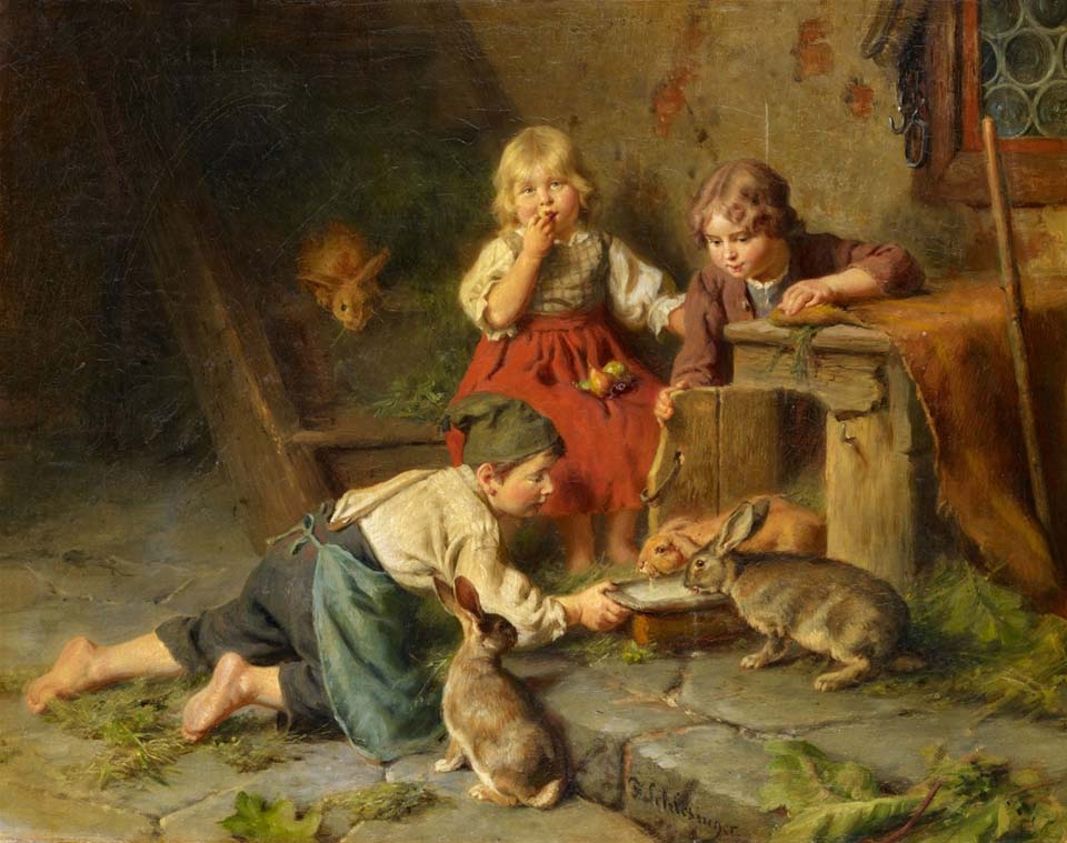 Three children feeding rabbits